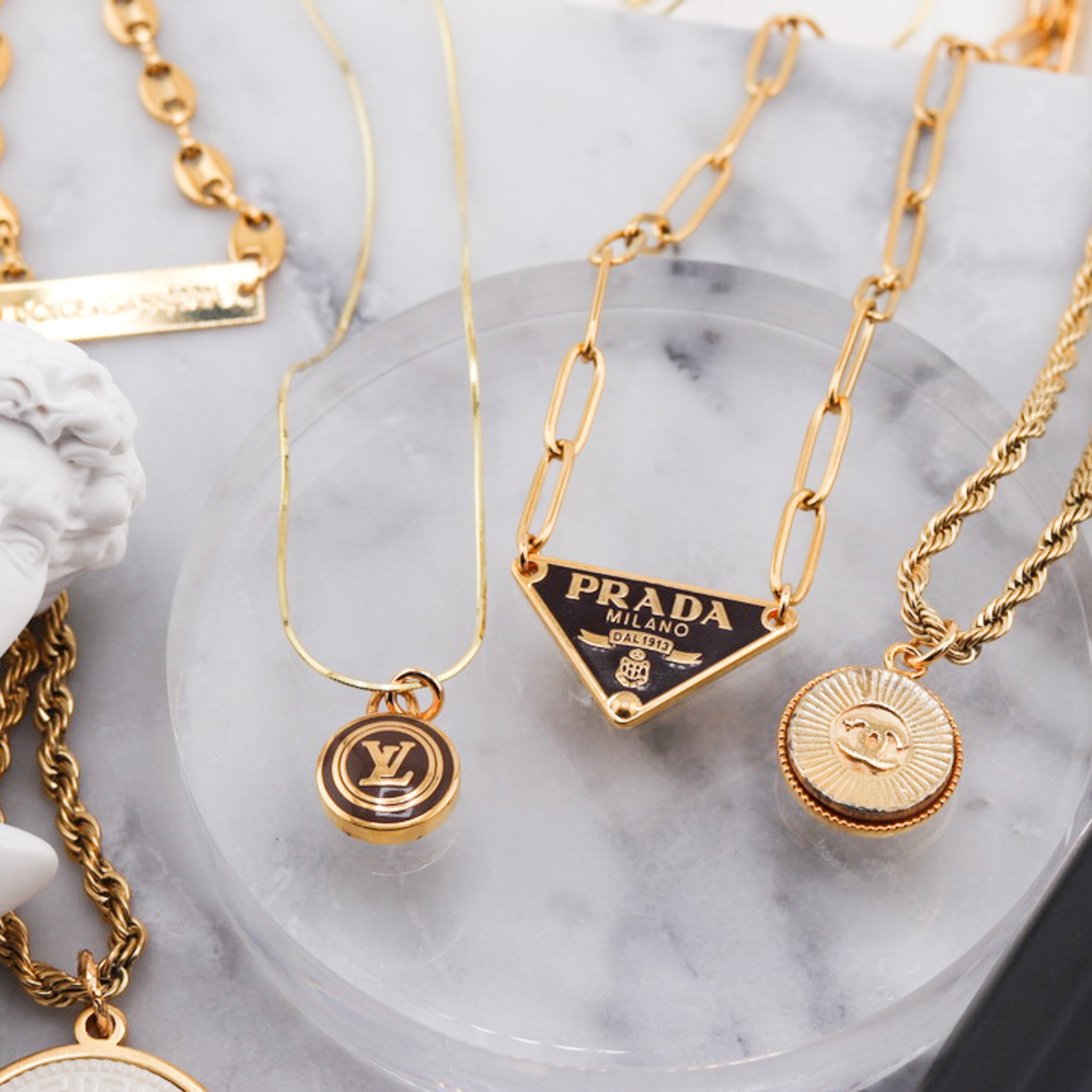 Prada Triangle Logo Collection — LUXE Reworked | Jewelry lookbook, Dream  jewelry, Jewelry fashion trends